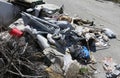 Pile of rags and garbage in a homeless camp after the forced evi