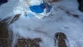 A pile of rags, in the middle of a white detergent foam