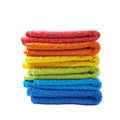 Pile of rainbow colored towels isolated Royalty Free Stock Photo