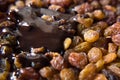 Pile of raisins covered with melt chocolate Royalty Free Stock Photo