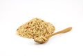 Pile of raw brown rice with wooden spoon on white background Royalty Free Stock Photo