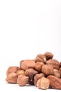 Pile of raw hazelnuts over white background Royalty Free Stock Photo