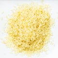 Pile of raw parboiled rice close up on gray Royalty Free Stock Photo