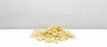 Pile of raw pinenuts pine nuts, in front of white background Royalty Free Stock Photo