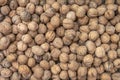 Pile of raw walnuts on the stock texture, top view Royalty Free Stock Photo