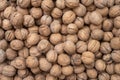 Pile of raw walnuts on the stock texture, top view Royalty Free Stock Photo