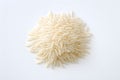 A pile of raw white rice on a white background. Top view.Close up of long rice grains can use for background and texture. Royalty Free Stock Photo