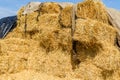 Pile of the rectangular straw bales on a farmyard
