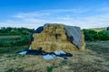 Pile of the rectangular straw bales on a farmyard