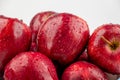 Pile of red appl with clear water drop on shell surface texture pattern isolated