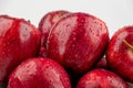 Pile of red appl with clear water drop on shell surface texture pattern isolated