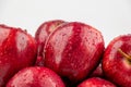 Pile of red appl with clear water drop on shell surface texture pattern isolated