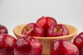 Pile of red apple in wooden bowl with clear water drop on  shell surface texture pattern isolated Royalty Free Stock Photo