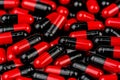 Pile of red-black capsule pills. Antibiotics resistance. Drug use with reasonable. Global healthcare concept. Antibiotics drug res