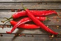 a pile of red chili peppers on a dark wooden background. close-up  macro Royalty Free Stock Photo