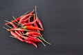 Pile of red chilli on black wooden background. Royalty Free Stock Photo