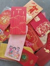 A pile of red packet containing gift of money packed inside given as token of good wishes during auspicious occasions