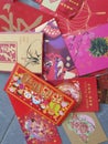 A pile of red packet containing gift of money packed inside given as token of good wishes during auspicious occasions