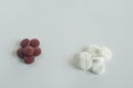 Pile of red and white pills on blue background with copy space. medicine concept Royalty Free Stock Photo