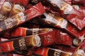 A pile of regular flavoured super instant coffee beverage sachets