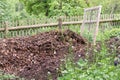 Pile with ripe compost and sieve Royalty Free Stock Photo