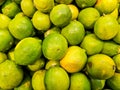 Pile of ripe green limes in a supermarket local market in Thailand Royalty Free Stock Photo