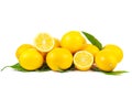 Pile of ripe lemons with green leaves isolated on a white