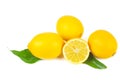 Pile of ripe lemons with green leaves isolated on a white