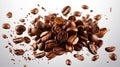 A pile of roasted coffee beans levitates against a white background with beans flying around the pile Royalty Free Stock Photo