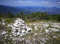 Pile of rocks on mountain trail in Carpathian mountains , Romania