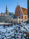 Pile of rocks under the snow. The House of the Blackheads. Riga, Latvia Royalty Free Stock Photo