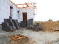 Pile of roof tiles ready to install on house roofing construction.