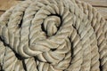 A pile of rope on the deck of a boat