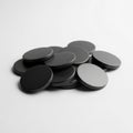 Pile of Round Black Objects on a White Background stack Royalty Free Stock Photo