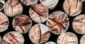 Pile of round chopped logs of wood texture pattern Royalty Free Stock Photo