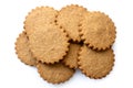 A pile of round gingerbread biscuits isolated on white from above. Serrated edge. Royalty Free Stock Photo