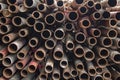 Pile of round old red, brown, rusty metal pipes. rough surface texture Royalty Free Stock Photo