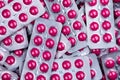 Pile of round pink tablets pill in blister pack. Pharmaceutical industry. Pharmacy products. Prescription drug. Painkiller Royalty Free Stock Photo