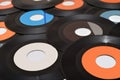 Pile of 45 rpm old vinyl records on the table Royalty Free Stock Photo