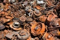 a pile of rusted car parts stacked haphazardly