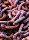 Pile of rusted chain links stacked together on top of each other Royalty Free Stock Photo
