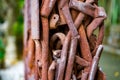 A pile of rusty water pipes and scrap iron twisted together
