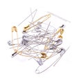 Pile of safety pins and needles isolated on white Royalty Free Stock Photo