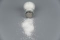 A pile of salt from salt shaker, concept excessive salt intake Royalty Free Stock Photo