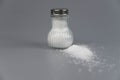 A pile of salt from salt shaker, concept excessive salt intake Royalty Free Stock Photo