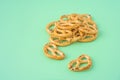 Pile of pretzels on green background, stock photo Royalty Free Stock Photo