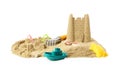 Pile of sand with beautiful castle, shells and plastic beach toys isolated on white Royalty Free Stock Photo