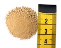 Pile of sand and measuring tape on white background, top view. Kidney stone disease Royalty Free Stock Photo