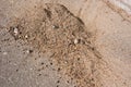 A pile of sand and pebbles on the asphalt Royalty Free Stock Photo