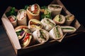 pile of sandwiches and wraps on wooden tray Royalty Free Stock Photo